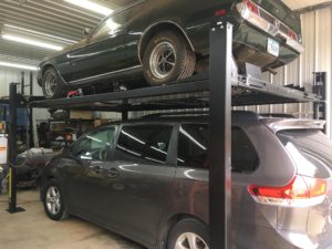 FP8K storage lift with mustang parked above a van